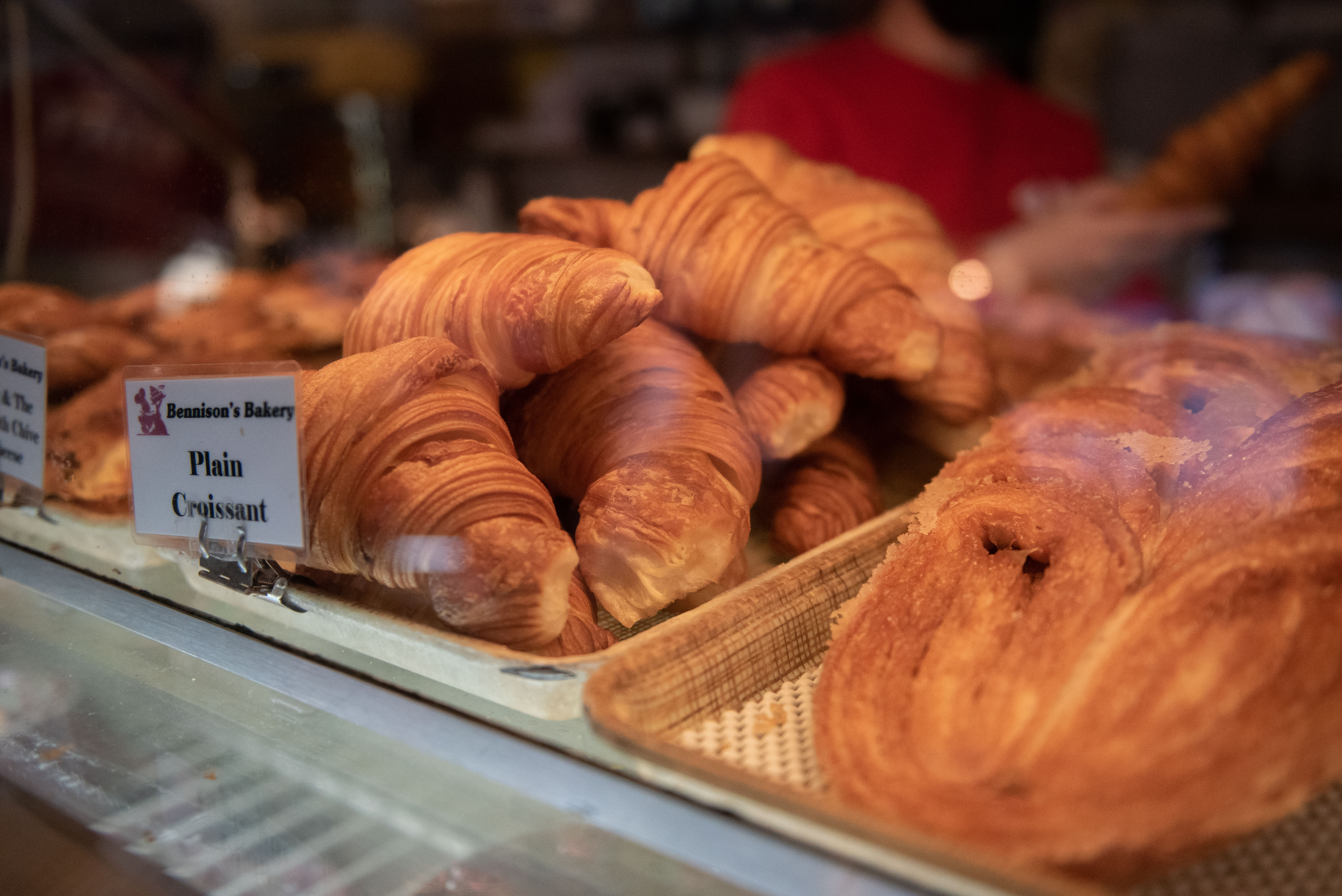 A pile of golden-brown croissants.