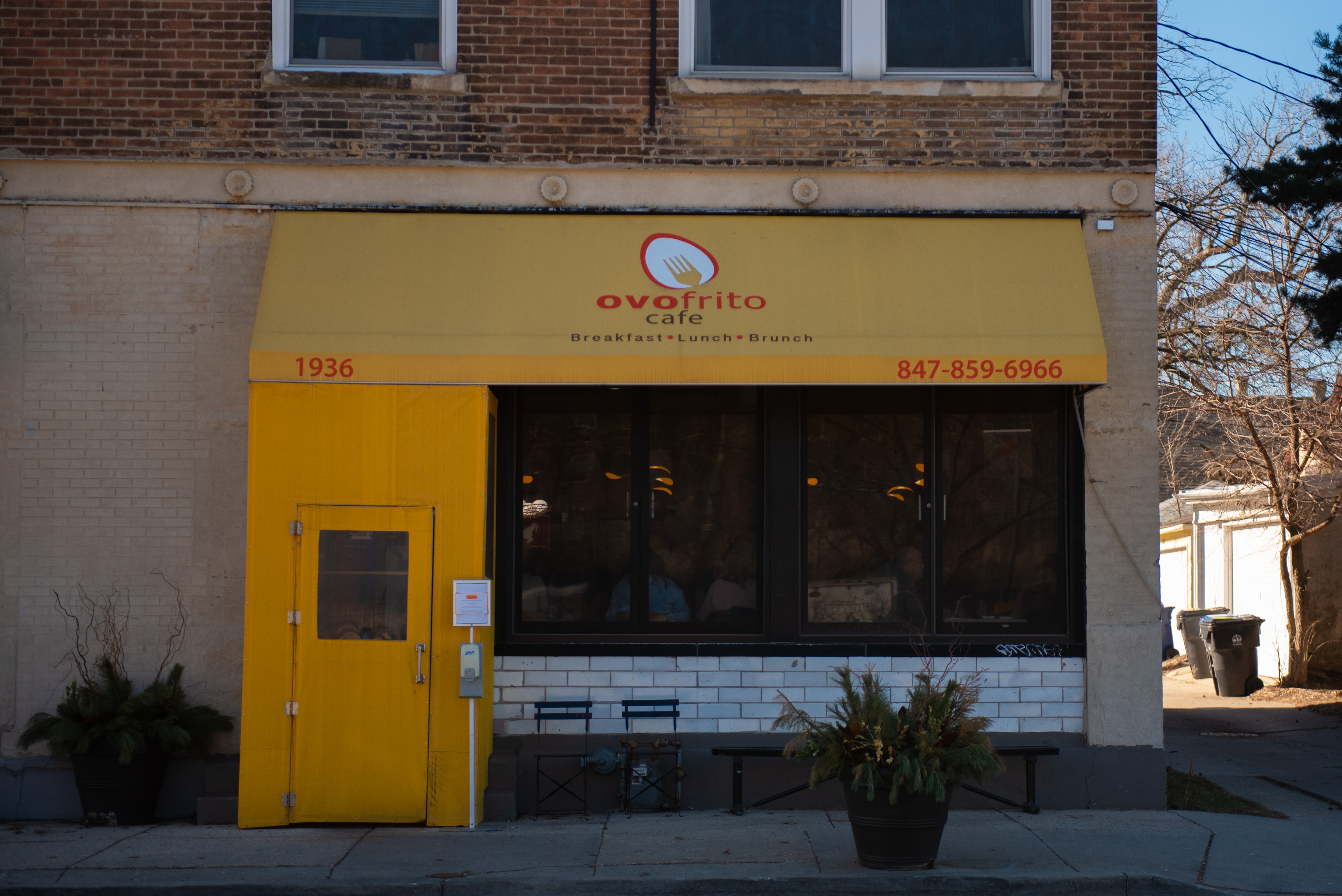 A yellow awning and a yellow door.