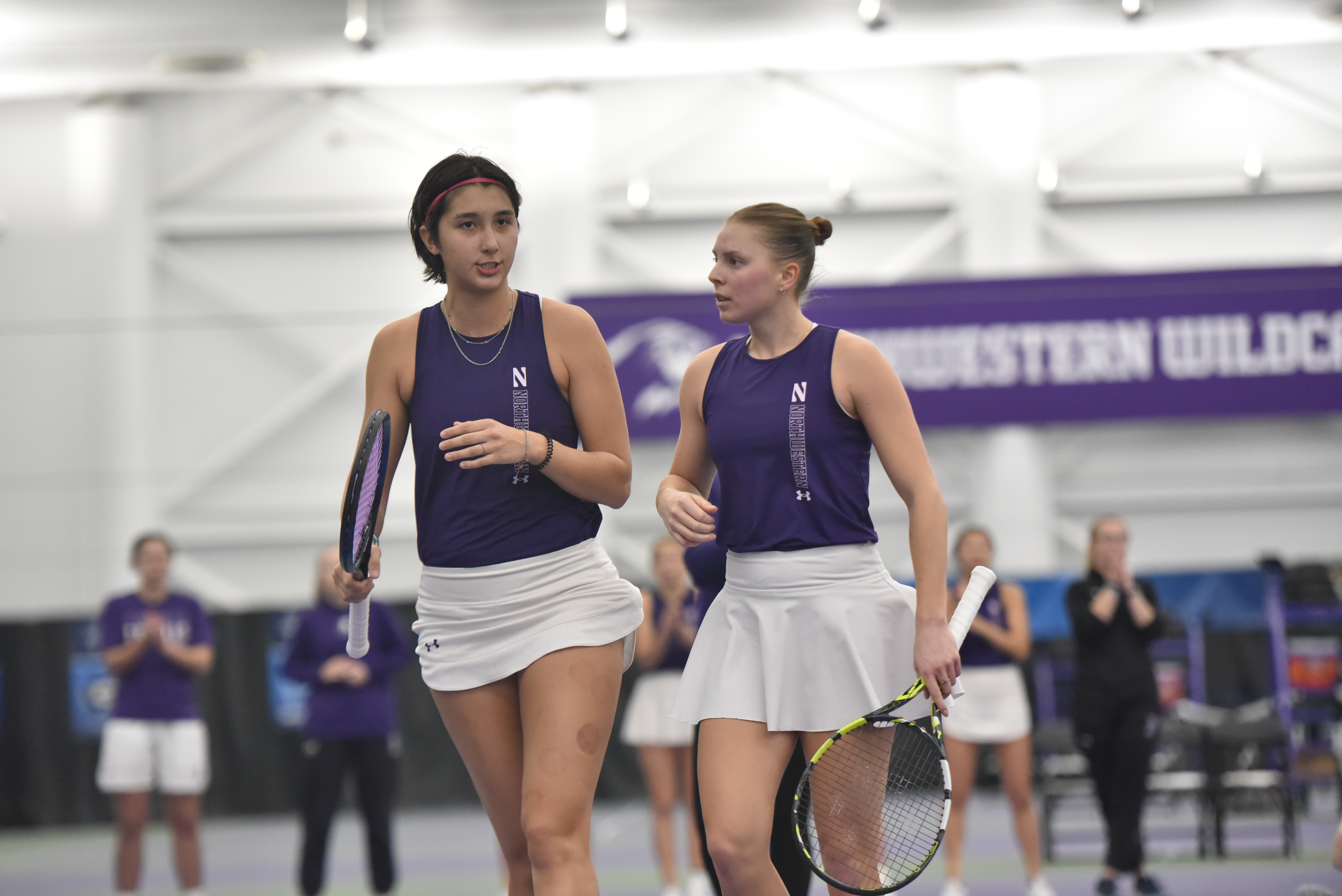 Freshman Erica Jessel and senior Sydney Pratt stand after a point in their match against No. 1 Georgia on Friday. The two registered a 6-2 win that day and a 6-0 victory against Stanford the following day.